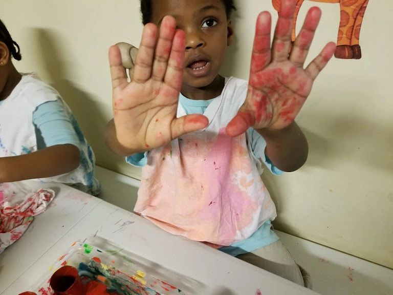 Children engaged in learning activities at Home4Kidz