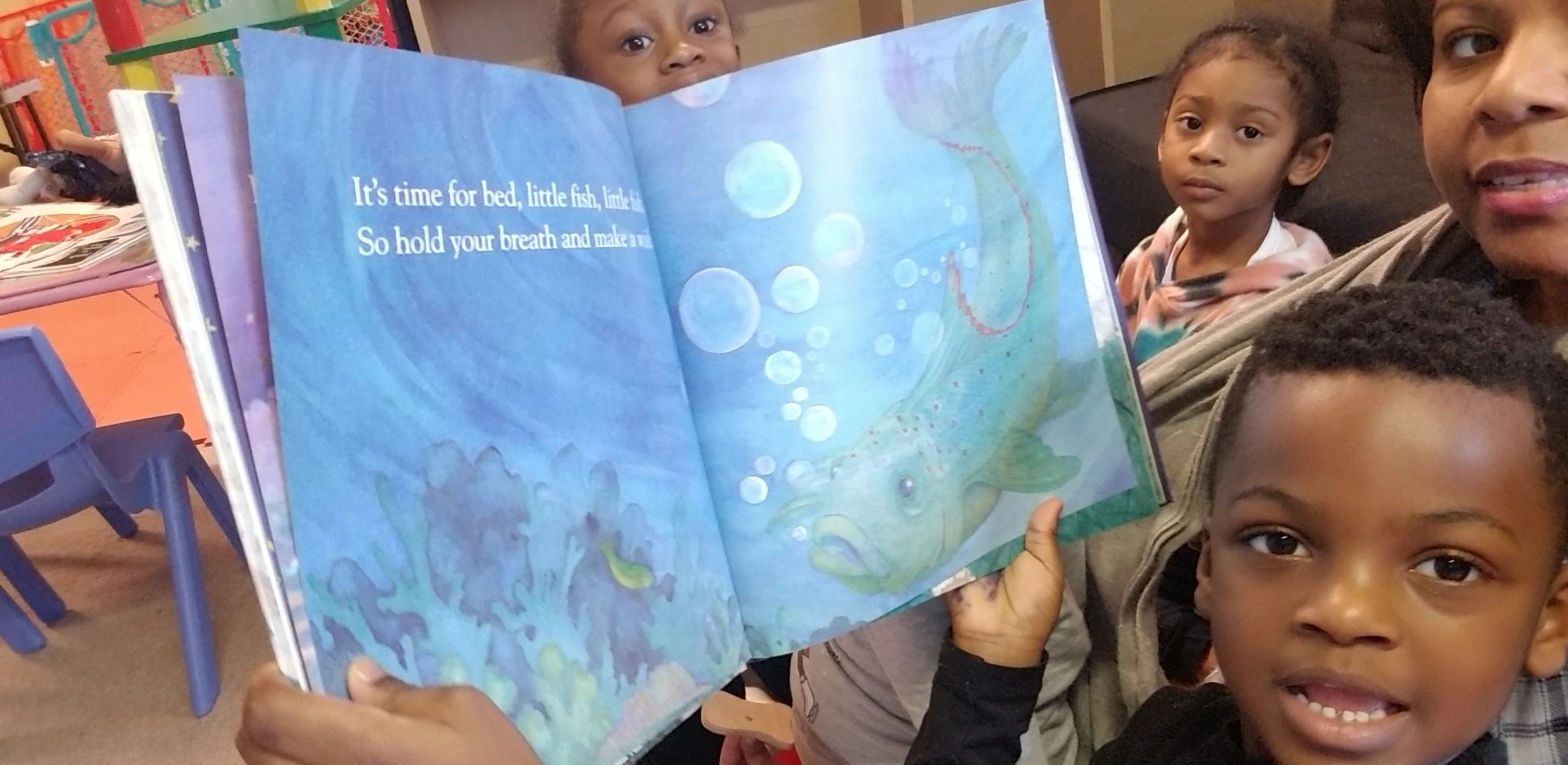 Children gathered for storytime at Home4Kidz