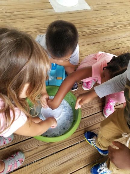 Children playing with soapy water at Home4Kidz